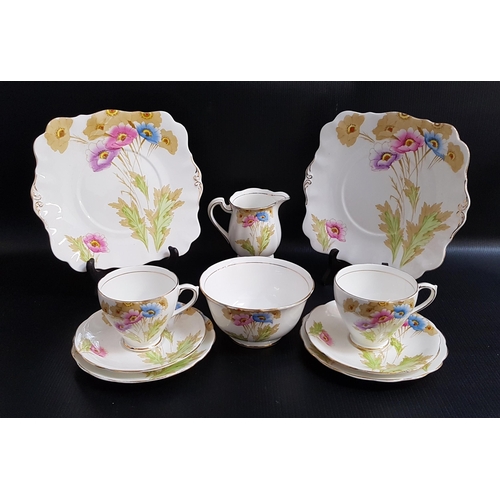 259 - ROYAL STANDARD CHINA TEA SET
decorated with colourful poppies with gilt highlights, comprising twelv... 