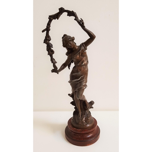 314 - AFTER AUGUSTE MOREAU
a spelter figure of a classical lady, raised on a turned wood base, 42.5cm high