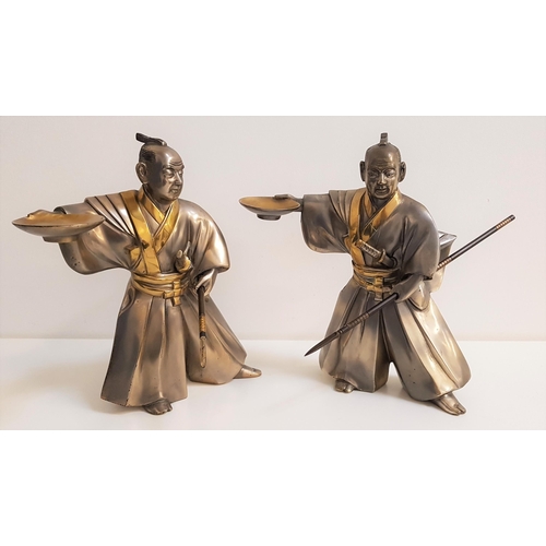 319 - PAIR OF JAPANESE STAINLESS STEEL FIGURE OF A SAMURAI
wearing kimonos and holding bowls in their rais... 