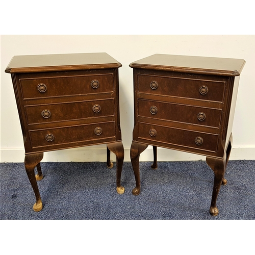 516 - PAIR OF FIGURED WALNUT BEDSIDE CHESTS
with a moulded top with canted corners above three drawers, st... 