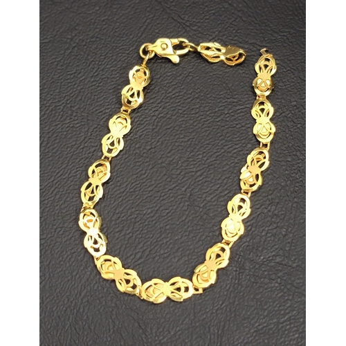 64 - TWENTY-TWO CARAT GOLD BRACELET
the pierced design links alternating between brushed and polished gol... 