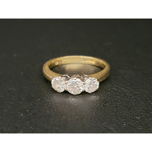 105 - DIAMOND THREE STONE RING
the diamonds totalling approximately 0.7cts, on eighteen carat gold shank, ... 