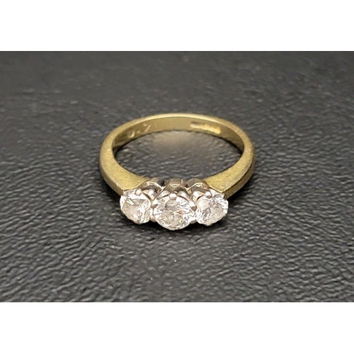 105 - DIAMOND THREE STONE RING
the diamonds totalling approximately 0.7cts, on eighteen carat gold shank, ... 