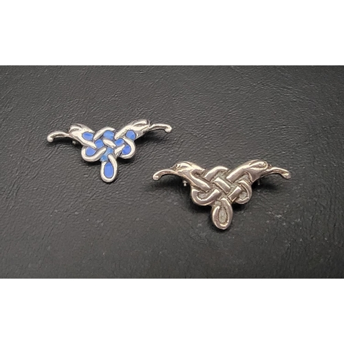 117 - TWO SCOTTISH SILVER BROOCHES
both on Celtic twin headed bird design, one with blue enamel by Iain Mc... 