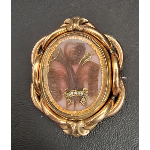 141 - VICTORIAN PINCHBECK MOURNING BROOCH
the revolving central section with glazed panel to each side, on... 