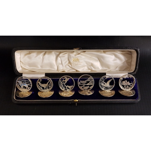 184 - SET OF SIX GEORGE V SILVER MENU HOLDERS
each with a circular base and decorated with a partridge, ph... 