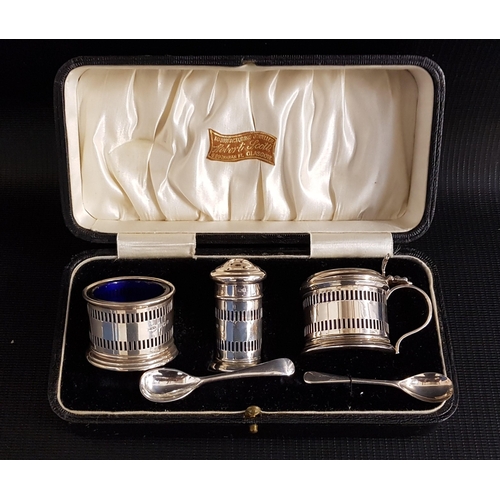 185 - GEORGE V SILVER CRUET SET
comprising a salt, pepper and lidded mustard pot all with blue glass liner... 