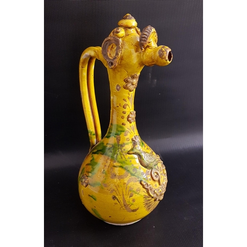 207 - 19th CENTURY CANNAKALE POTTERY EWER
decorated with a yellow and green glaze and applied flowers, bir... 