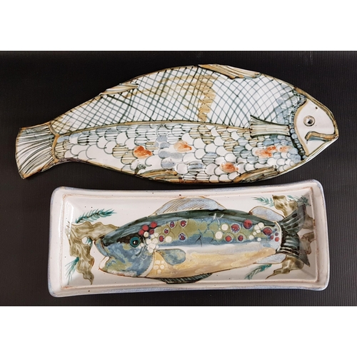 240 - HIGHLAND STONEWARE FISH DISH
decorated with a fish and reeds, 38.5cm long, together with a fish plat... 