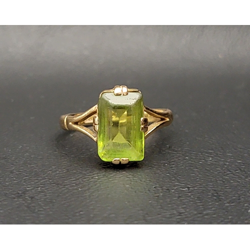 85 - PERIDOT SINGLE STONE RING
the step cut peridot on eighteen carat gold shank with split shoulders, ri... 