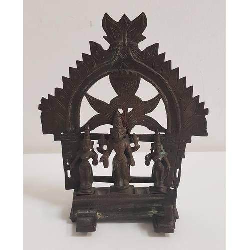 332 - INDIAN BRONZE SHRINE
with an arched top above Shiva, flanked by attendants on an oblong stepped base... 