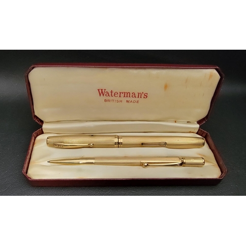 313 - WATERMAN'S NINE CARAT GOLD PEN AND PENCIL SET
the side filling fountain pen with fourteen carat gold... 