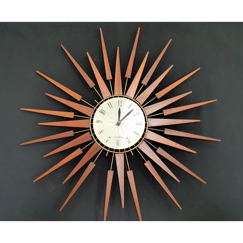 289 - SETH THOMAS SCOTTISH SUN BURST WALL CLOCK
with a circular dial with Arabic numerals surrounded by me... 