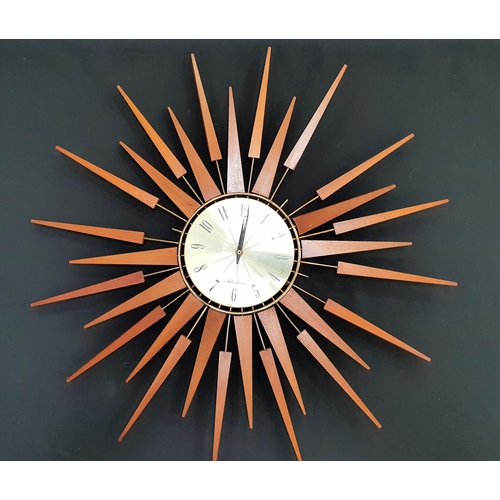 296 - SETH THOMAS SCOTTISH SUN BURST WALL CLOCK
with a circular dial with Arabic numerals surrounded by me... 