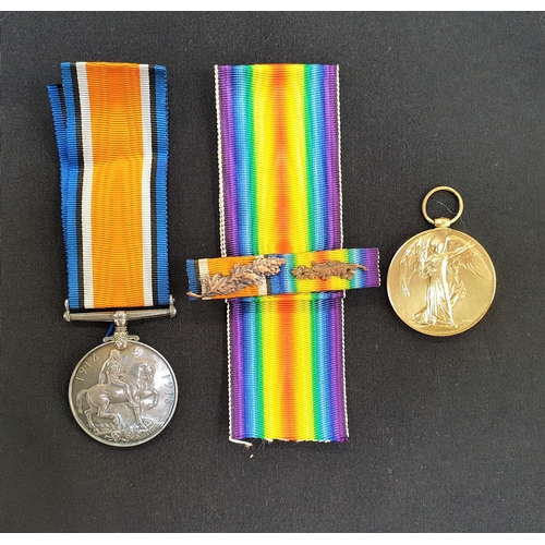 426 - WWI MEDAL PAIR
named to E.A.McFarlane V.A.D., the British War and Victory Medal with two oak leaves