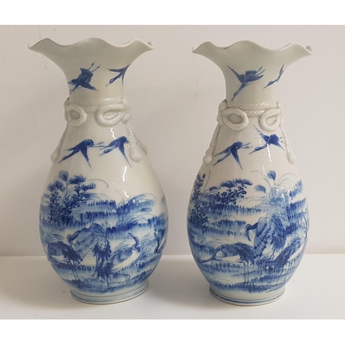 271 - PAIR OF CHINESE BLUE AND WHITE PORCELAIN VASES
with a frilled collar above bow decoration, the bodie... 