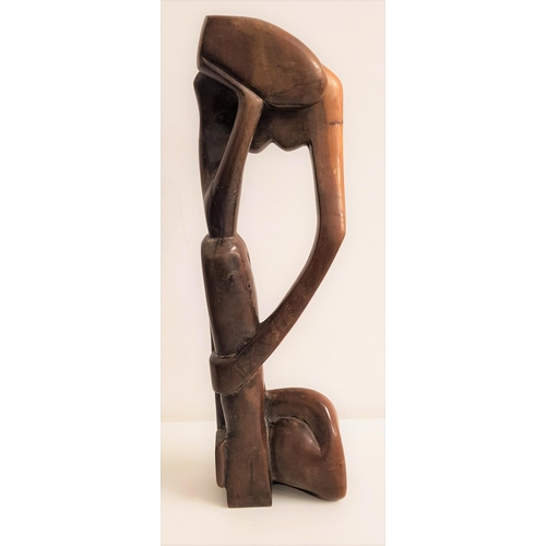 325 - FESTUS IDEHEN (Nigerian b.1928)
man and woman embracing, carved teak, signed Festus to the base, 43.... 