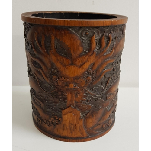 327 - CHINESE BAMBOO BRUSH POT
carved in relief with a mythical beast, 15cm high