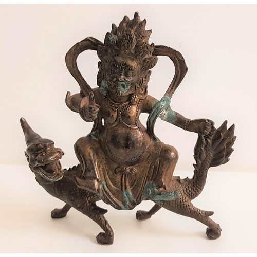 329 - BRONZE TIBETAN FIGURE OF MAHAKALA
riding a mythical beast, 20.5cm high