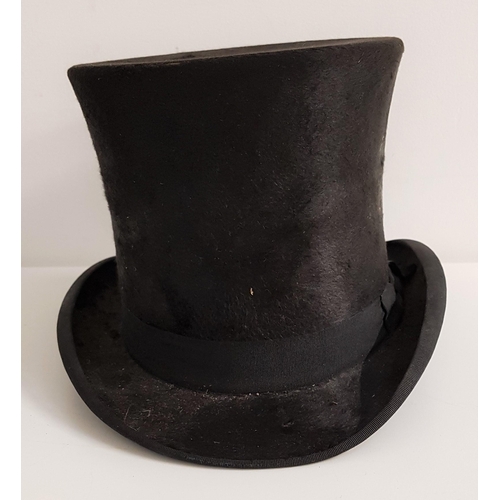 355 - GENTLEMANS BLACK SILK TOP HAT
internal measurements front to back 18.5cm and side to side 14.6cm