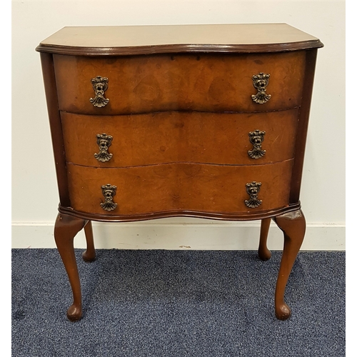 558 - WALNUT SERPENTINE CHEST
with a moulded top above three drawers, standing on cabriole supports, 71.5c... 