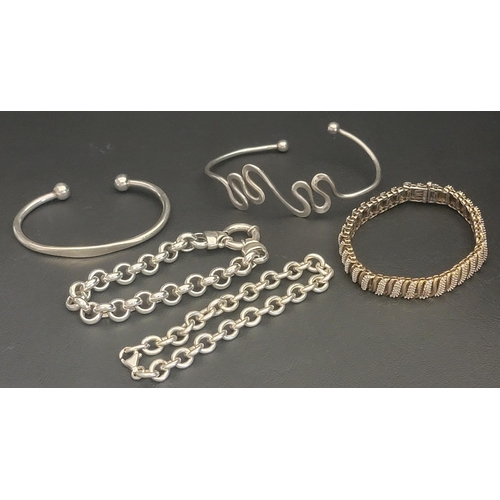 176 - SELECTION OF SILVER BRACELETS
comprising two chain bracelets, a cuff bangle, a wave design cuff bang... 