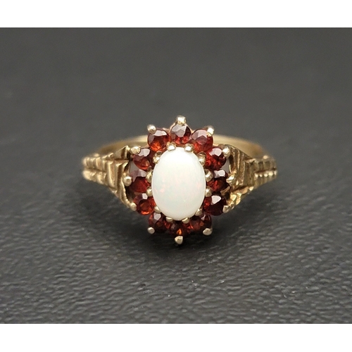 OPAL AND GARNET CLUSTER RING
the central oval cabochon opal in twelve garnet surround, on nine carat gold shank with textured shoulders, ring size N