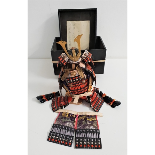 334 - JAPANESE MINATURE SAMURAI WARRIOR SUIT OF ARMOUR
comprising helmet, main suit and leg sections, with... 