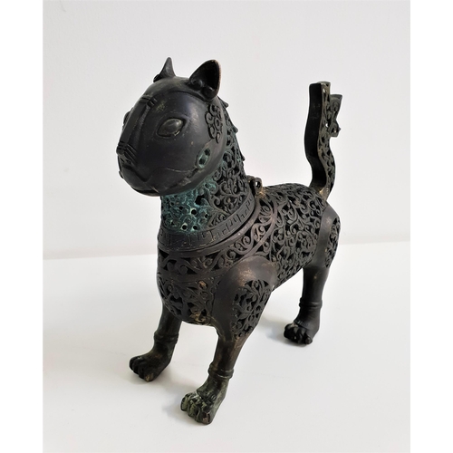 342 - HOLLOW CAST BRONZE INCENSE BURNER
of a standing cat with pierced scroll decoration overall and a hin... 