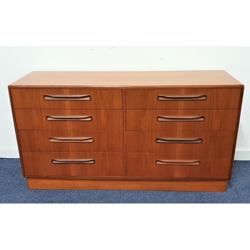 514 - G PLAN FRESCO TEAK CHEST OF DRAWERS
with a moulded top above eight drawers with roll over handles, s... 