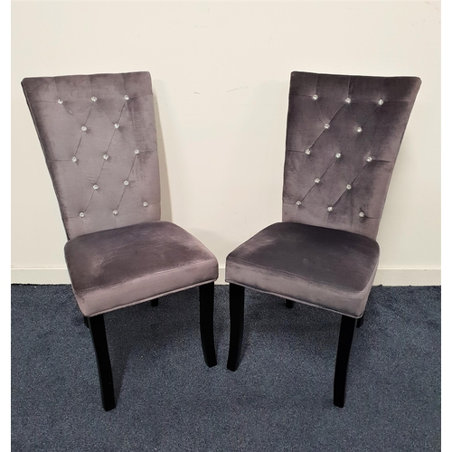 537 - PAIR OF SIDE CHAIRS
covered in a grey velvet with a crystal button backs, standing on shaped front s... 