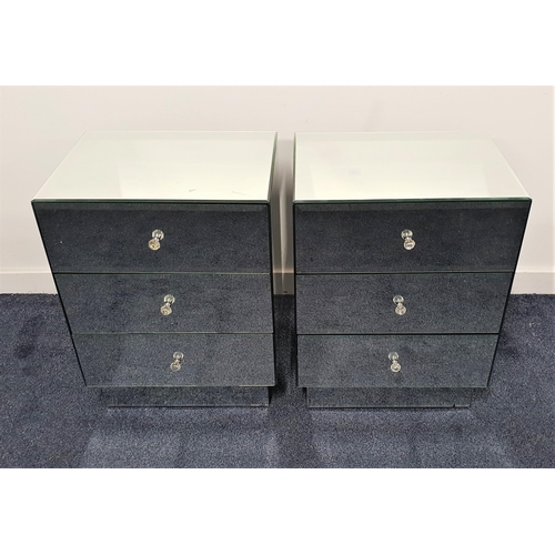 550 - PAIR OF MIRRORED BEDSIDE CHESTS
with bevelled tops above three drawers, standing on a plinth base, 6... 