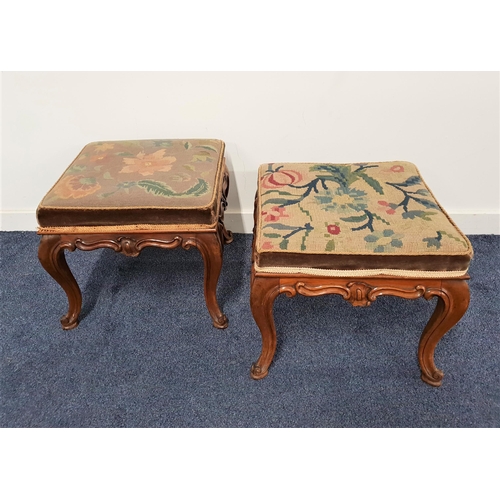 564 - PAIR OF 19th CENTURY WALNUT STOOLS
with square needlepoint tops above a carved frieze, standing on c... 