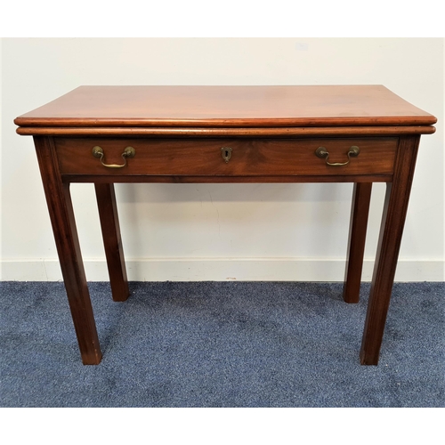 506 - GEORGE III MAHOGANY TEA TABLE
with a fold over top and swing out rear legs, and a frieze drawer, sta... 