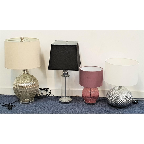 534 - FOUR SINGLE LAMPS
including a squat mauve glass lamp and mauve shade, 40cm high, silvered mottled bu... 