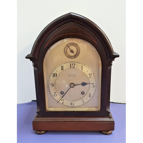 556 - EARLY 20th CENTURY MAHOGANY BRACKET CLOCK
in an arched case with a shaped silvered dial marked 'Edwa... 