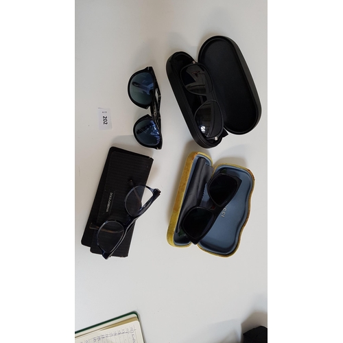 202 - FOUR PAIRS OF DESIGNER SUNGLASSES AND GLASSES
comprising Steve McQueen Persol 714 sunglasses, Boss 1... 