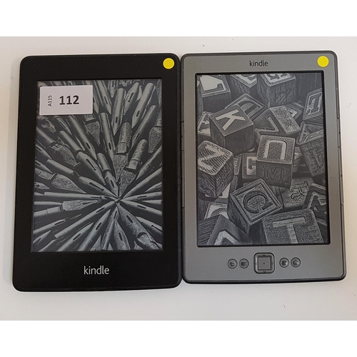 112 - TWO AMAZON KINDLE E-READERS
comprising a Kindle Paperwhite Wifi, serial number B024 1204 3047 01XS; ... 