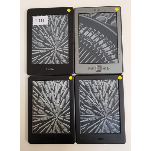 113 - FOUR AMAZON KINDLE E-READERS
comprising a Kindle Paperwhite, serial number B024 1502 2487 04H5; a Ki... 