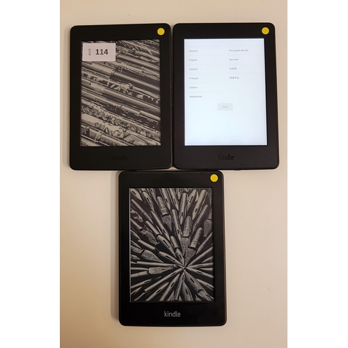 114 - THREE AMAZON KINDLE E-READERS
comprising two Kindle Paperwhite 3, serial numbers G090 G105 7454 0HGF... 