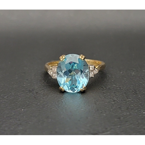 30 - BLUE TOPAZ AND DIAMOND DRESS RING 
the oval cut blue topaz measuring approximately 11.7mm x 9.8mm x ... 