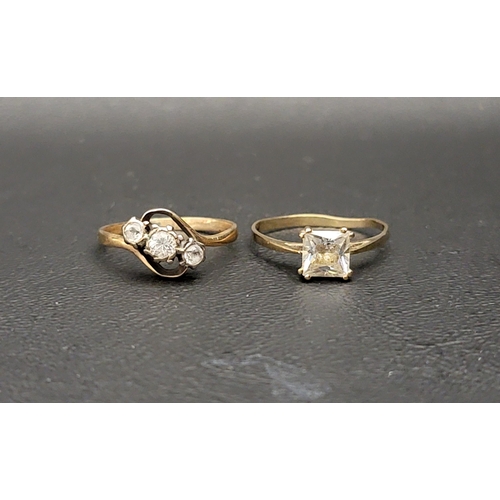33 - CLEAR GEM SET THREE STONE RING
on nine carat gold shank with twist setting, ring size M-N; and a CZ ... 