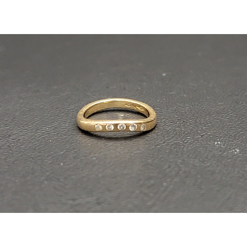 56 - DIAMOND SET EIGHTEEN CARAT GOLD RING
the five small flush set diamonds set in a wavy band, ring size... 