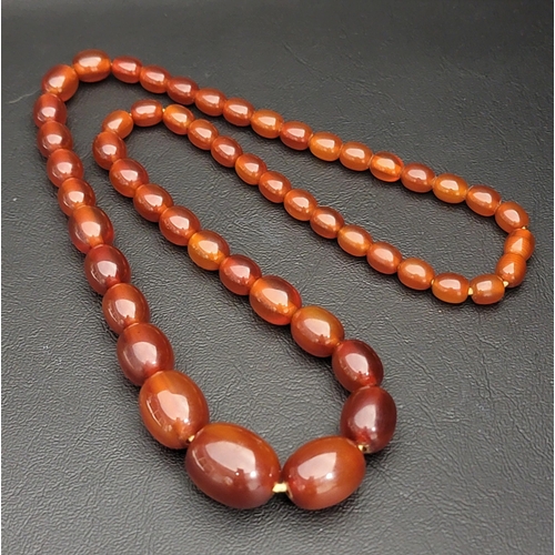 89 - GRADUATED AMBER COLOURED BEAD NECKLACE
approximately 61cm long and 44 grams