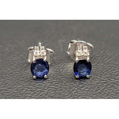 95 - PAIR OF SAPPHIRE AND DIAMOND STUD EARRINGS
the oval cut sapphires totalling approximately 0.85cts an... 