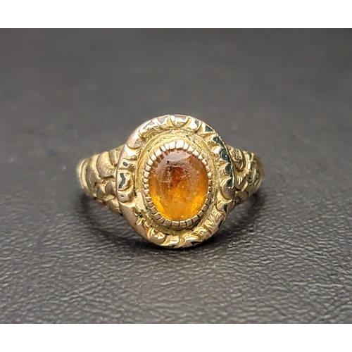 142 - UNMARKED GOLD RING
with central foil backed faceted glass, the shank with scroll detail, ring size P... 