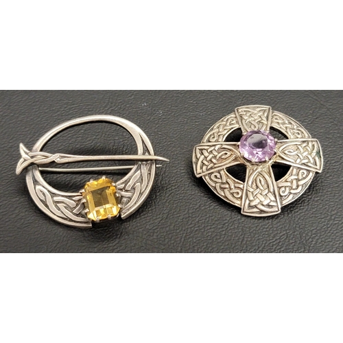148 - TWO JOHN HART IONA SILVER BROOCHES
one a Tara style brooch set with citrine, the other of circular a... 