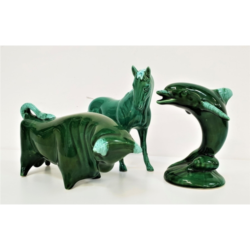 196 - TRENTHAM POTTERY BULL
by Colin Melbourne, with a green glazed body, 31cm long, a green glazed dolphi... 