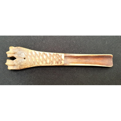 284 - 19th CENTURY CARVED BONE CHEESE SCOOP
with lattice style carved decoration, 14cm long