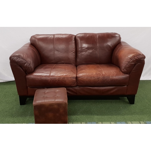BROWN LEATHER SOFA
with rollover arms, standing on stout shaped supports, 170cm long, together with a matching footstool (2)